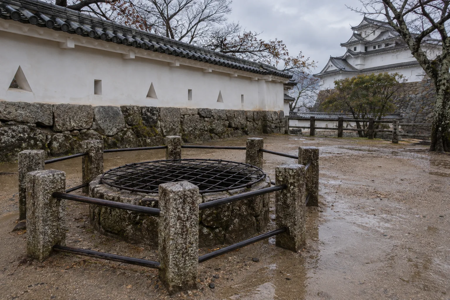 Okiku's Well inspired stone enclosure in an eerie Japanese castle courtyard